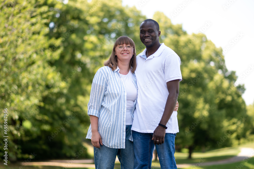 Happy couple in the park looking in love and romantic Happy couple in the park looking in love and romantic