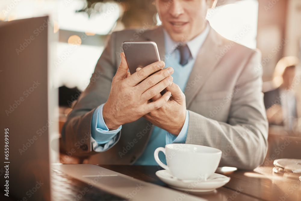 Happy young caucasian businessman using a phone in a cafe Happy young caucasian businessman using a phone in a cafe