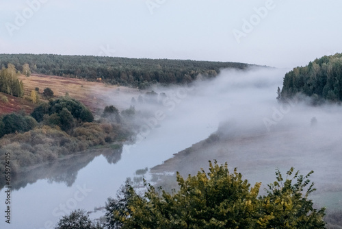 Autumn landscape.Forest and river with fog.