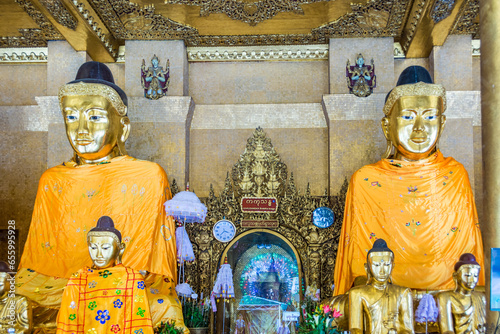 Kakusandha buddha image covered with foilgold photo