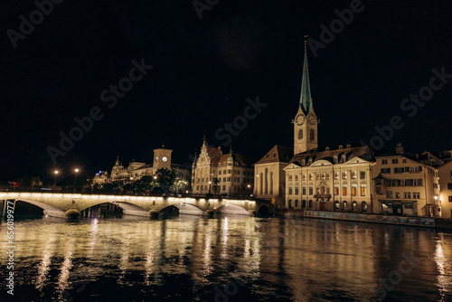 View of historic Zurich city center with famous Fraumunster Church and river Limmat at Lake Zurich   in twilight  Canton of Zurich  Switzerland.