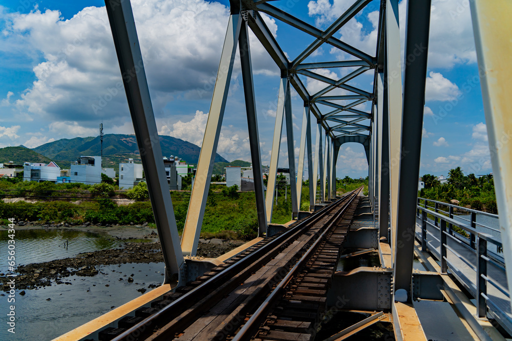 Railway bridge over the river. The old railway in the city of Nha Trang in Vietnam.