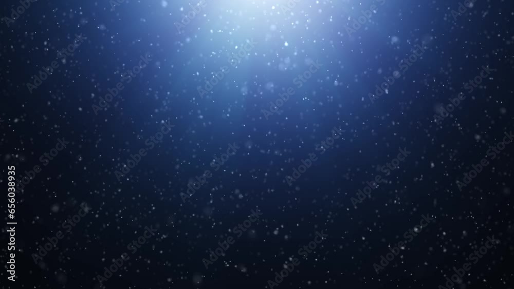 Beautiful loop slow motion snowfall on dark blue background. Concept Christmas and New Years winter animation.