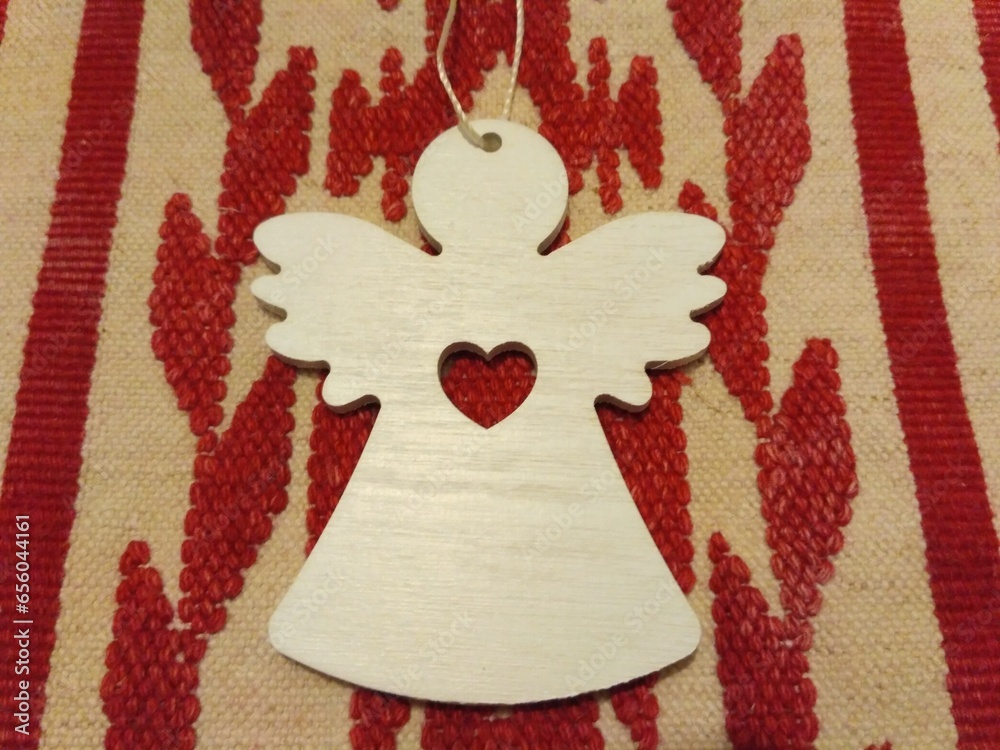 wooden angel on an embroidered towel wooden angel on an embroidered towel