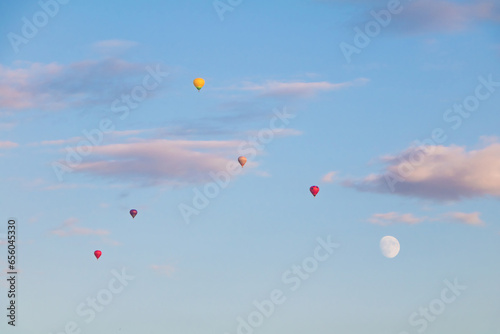 Flying hot air balloons in the evening sky