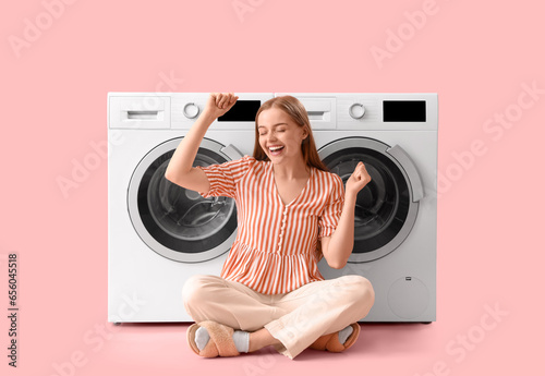 Happy young woman sitting n...