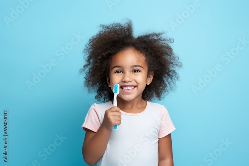 smiling black girl with toothbrush in hand | Dental care for children Generative Ai
