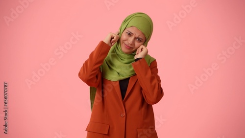 Fotografie Medium-sized isolated photo capturing an attractive young woman wearing a hijab, veil