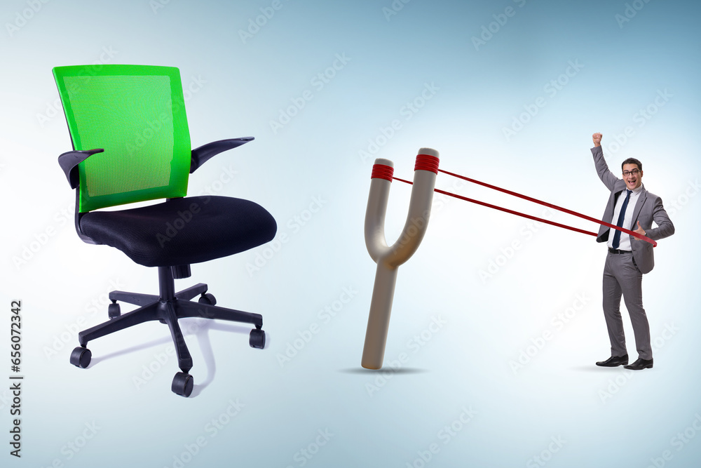 Career concept with businessman launched from slingshot Career concept with businessman launched from slingshot