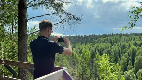 Happy young man background Marble canyon in Ruskeala, Karelia photo