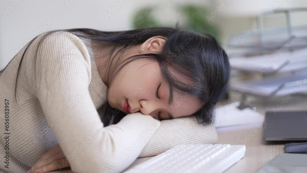 Tired sleepy woman fell asleep while sitting at the table at home. Tired sleepy woman fell asleep while sitting at the table at home.