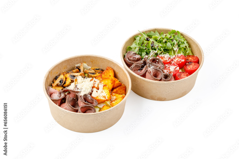 Salad with roast beef and truffle oil and Salad with roast beef and potatoes on a white background, studio shot Salad with roast beef and truffle oil and Salad with roast beef and potatoes on a white background, studio shot