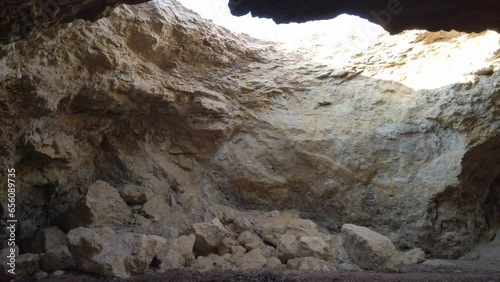 Cave with hole overlooking the sky. Sicily. photo