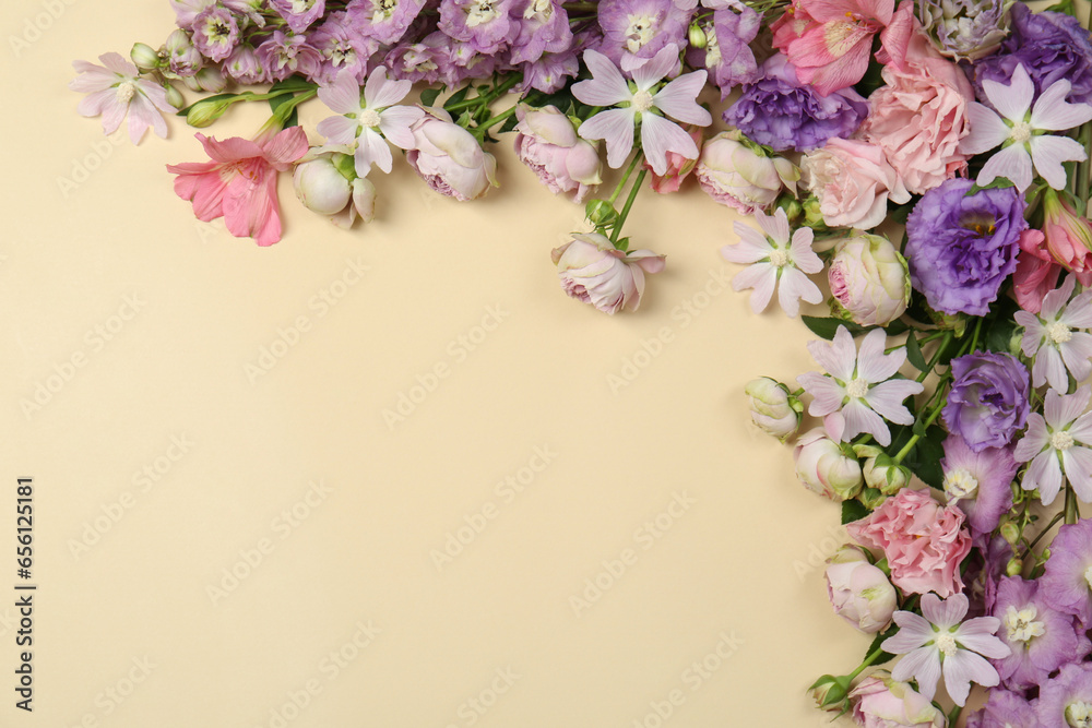 Flat lay composition with different beautiful flowers on beige background, space for text