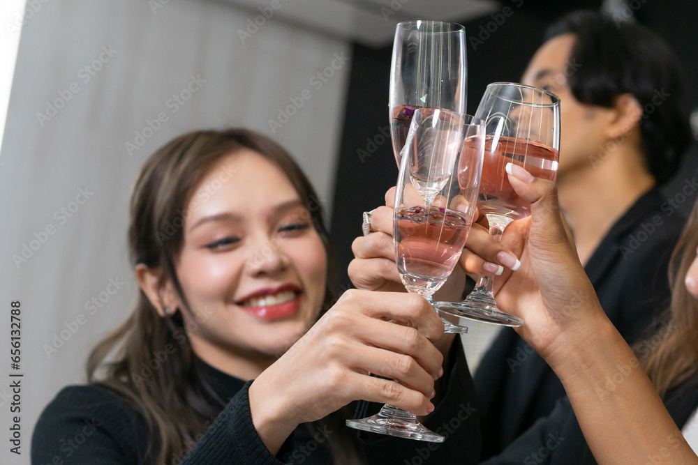 Making a toast, Cheers !! A group of diverse business people and colleagues having fun and meet up together at a business New Year party. A teamwork celebration of a successful business target. Making a toast, Cheers !! A group of diverse business people and colleagues having fun and meet up together at a business New Year party. A teamwork celebration of a successful business target.