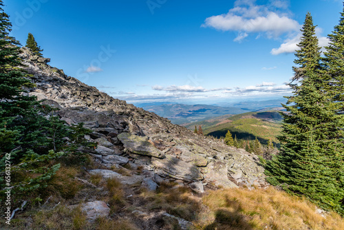 Idaho in the Background Behind Large Piles of Granite Boulders on Top of Mount Spokane. Mead, Washington.