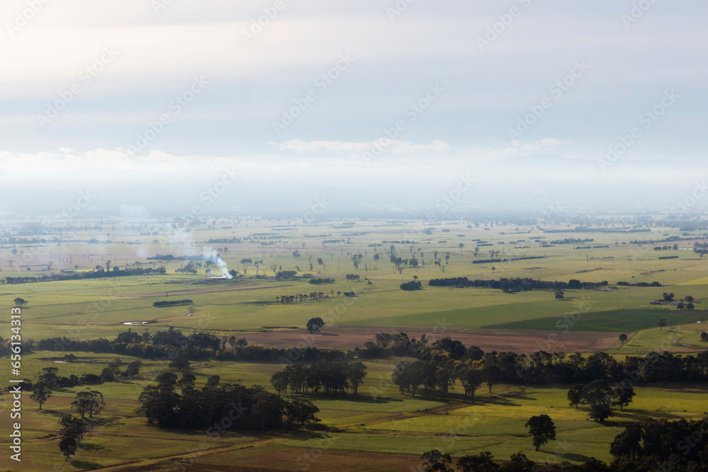 Controlled Burns Within Agricultural Landscape Creating a Rustic Countryside Scene