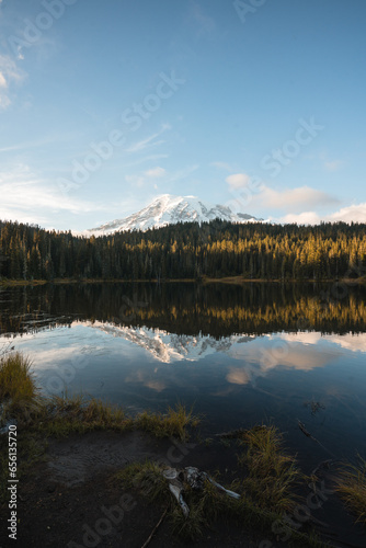 reflection in the lake with a snow mountain background during a clear sunny day