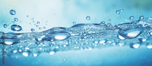 Blurred close up of serene transparent blue water with bubbles a trendy summer background for product advertising