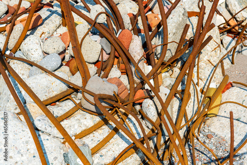Photography weathered and rusted rebar metal and broken concrete construction demolition was