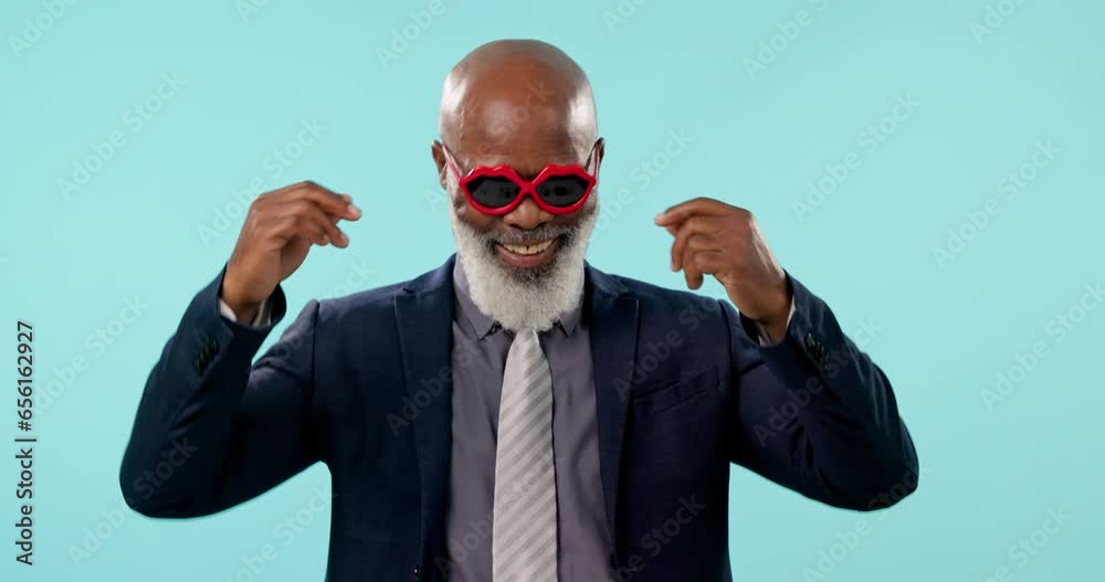 Senior business man, dance and studio with smile, emoji or excited in sunglasses by blue background. African corporate executive, happy CEO or dancer with celebration for success, achievement or goal