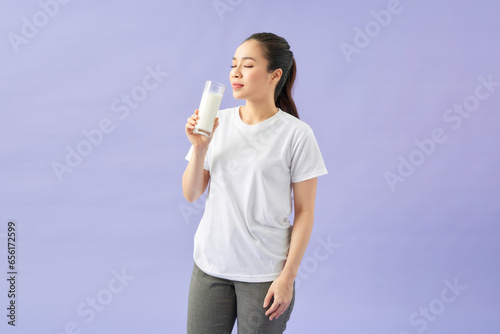 beauty woman Asian cute girl feel happy drinking milk for good health in the morning