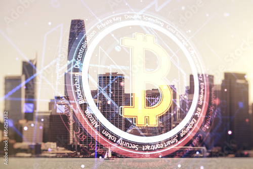 Double exposure of creative Bitcoin symbol hologram on San Francisco office buildings background. Mining and blockchain concept