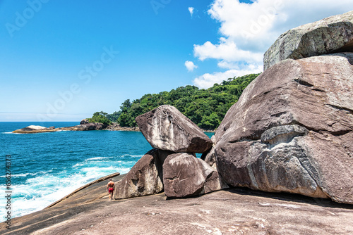 Beach Caxadaco with stones and transparent sea at island Ilha Grande, Rio de Janeiro, Brazil