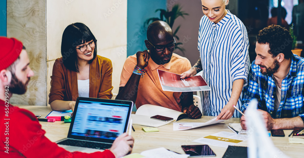 © BullRun - creative group of designers teamworking on meeting table share ideas and communicating