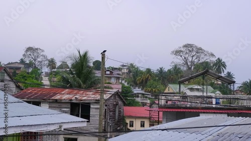 A look over the rooftops on an overcast day of the town of San Ignacio, Cayo District, Belize. Locked shot photo