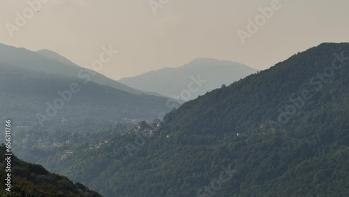 Beautiful Mountain Range and Sky in a Sunny Summer Day in Malcantone, Ticino, Switzerland. photo