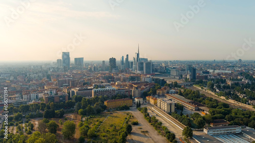 Milan, Italy - July 15, 2023: The famous skyscrapers of Milan are located around the botanical garden Campo di Fiori BAM. Milano Porta Garibaldi train station, Aerial View