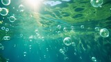 Underwater bokeh and bubbles in the Californian ocean's clear, green water