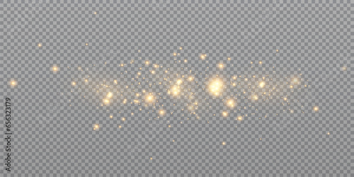 Golden sequins glow with many lights. Glittering dust. Luxurious background of golden particles.