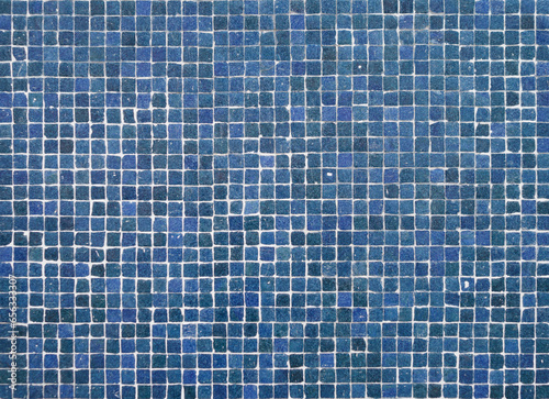 Part of a typical Portuguese wall decorated with tiles. Nice shades of blue and green. Portugal. Horizontal photo.