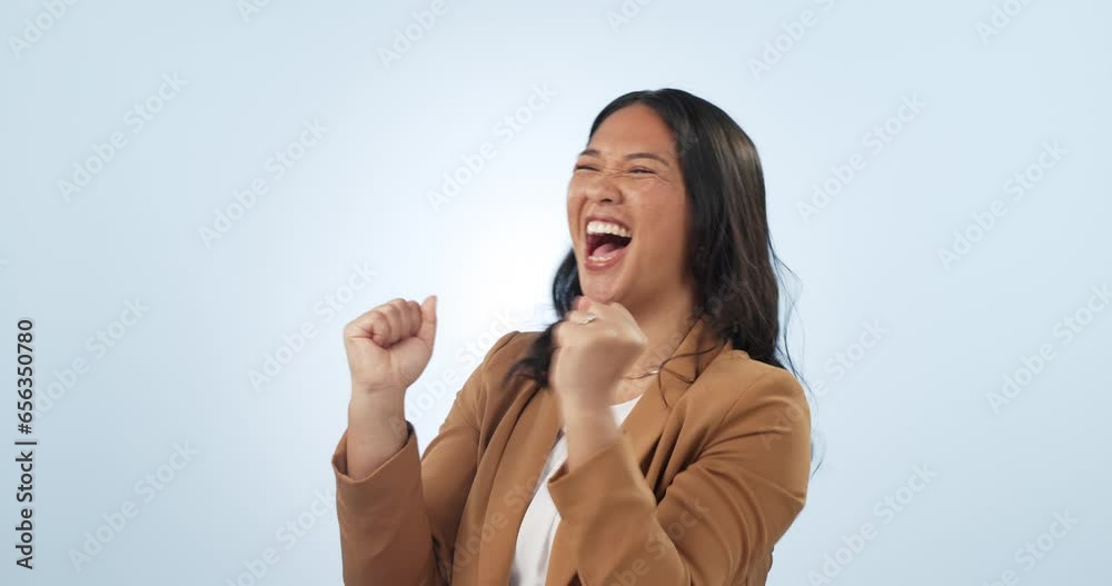 Excited, celebration and business woman with announcement, winner and yay from news in studio. Winning, promotion and success with wow from achievement of a female entrepreneur with blue background
