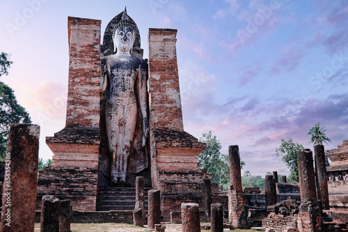 Sukhothai Wat Mahathat Buddha statues at Wat Mahathat ancient capital of Sukhothai Thailand. Sukhothai Historical Park is the UNESCO world heritage photo