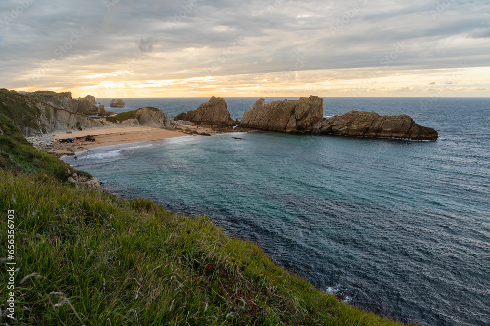 Playa de la Arnia in Santander, Cantabria, North Spain with cliffs and sandy beach. Popular travel destination 