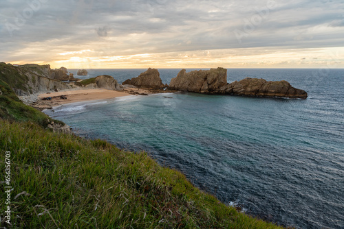 Playa de la Arnia in Santander, Cantabria, North Spain with cliffs and sandy beach. Popular travel destination 