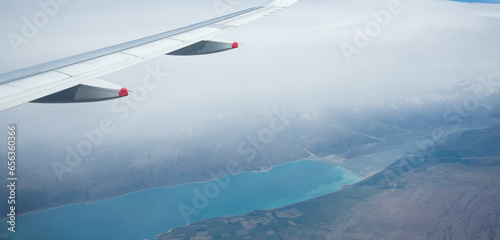 Aerial view of Lake Pukaki in heavy fog, from an airplane flying from Auckland to Queenstown. South Island.