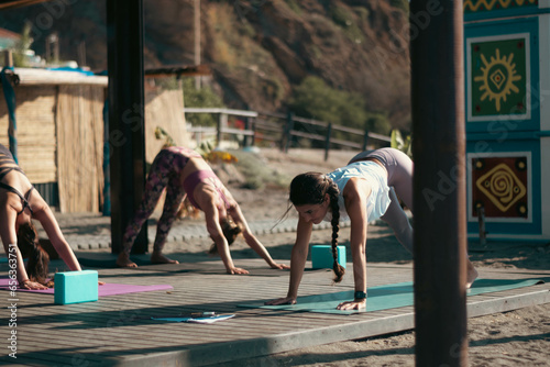 a group of girls in yoga class