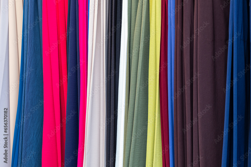 Close up view on samples of cloth and fabrics in different colors found at a fabrics market. Close up view on samples of cloth and fabrics in different colors found at a fabrics market.