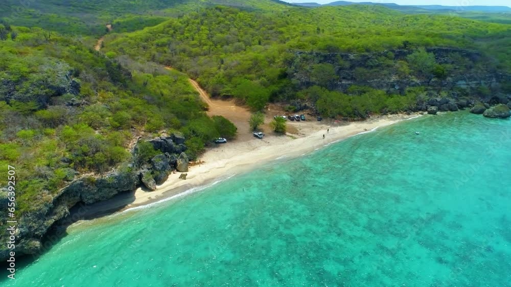 Aerial orbit or parallax around golden sand of San Juan beach Curacao Aerial orbit or parallax around golden sand of San Juan beach Curacao