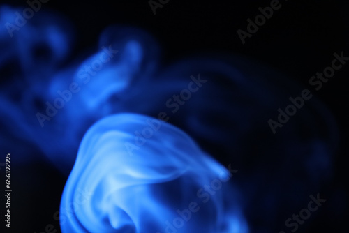 Blue smoke on a dark background, fog pattern, detailed smoke shapes