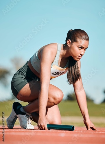 Start, running and relay with woman on race track with baton for sports, competition and marathon. Exercise, health and wellness with runner in stadium for challenge, speed and energy performance