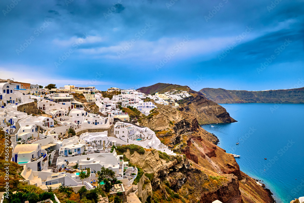 Aerial of Santorini island and towns and cruise ships in bay, Greece