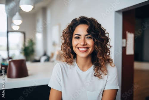 Smiling portrait of a young caucasian woman in a dentists office © Geber86