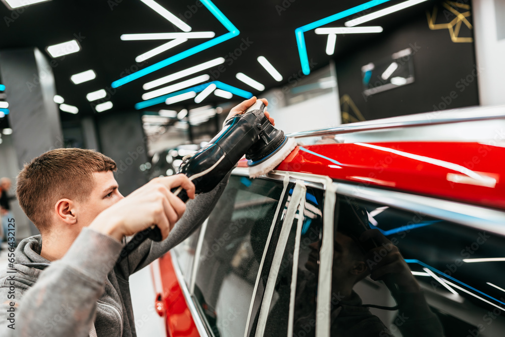 Professional vehicle polishing and detailing service in a modern car