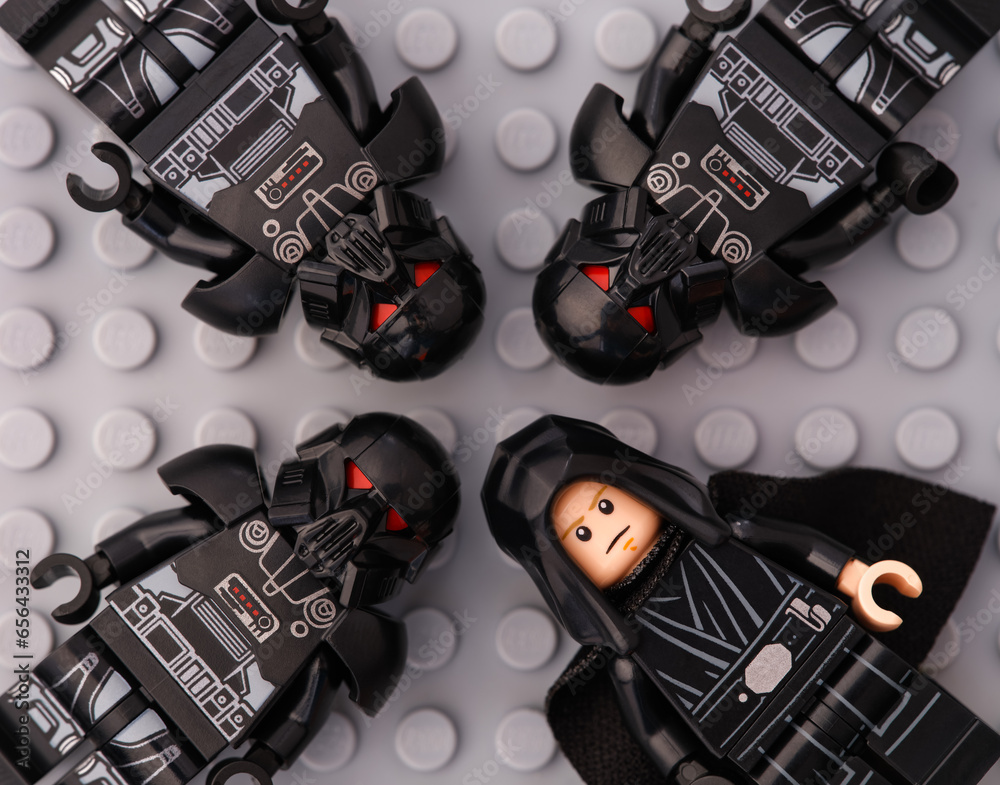 Naklejka premium Tambov, Russian Federation - October 01, 2023 Four Lego Star Wars character minifigures - Luke Skywalker and 3 Dark Troopers, on a gray baseplate background.