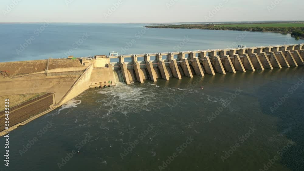 Large flock of swallows fly above turbulent water released from sluice gate in Bloemhof Dam wall Large flock of swallows fly above turbulent water released from sluice gate in Bloemhof Dam wall